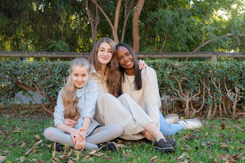 Multiethnic family enjoying time together in a park Child Custody Lawyer Levy Craig Navigating Child Custody for Non-Traditional FamiliesAdobeStock_1317904365